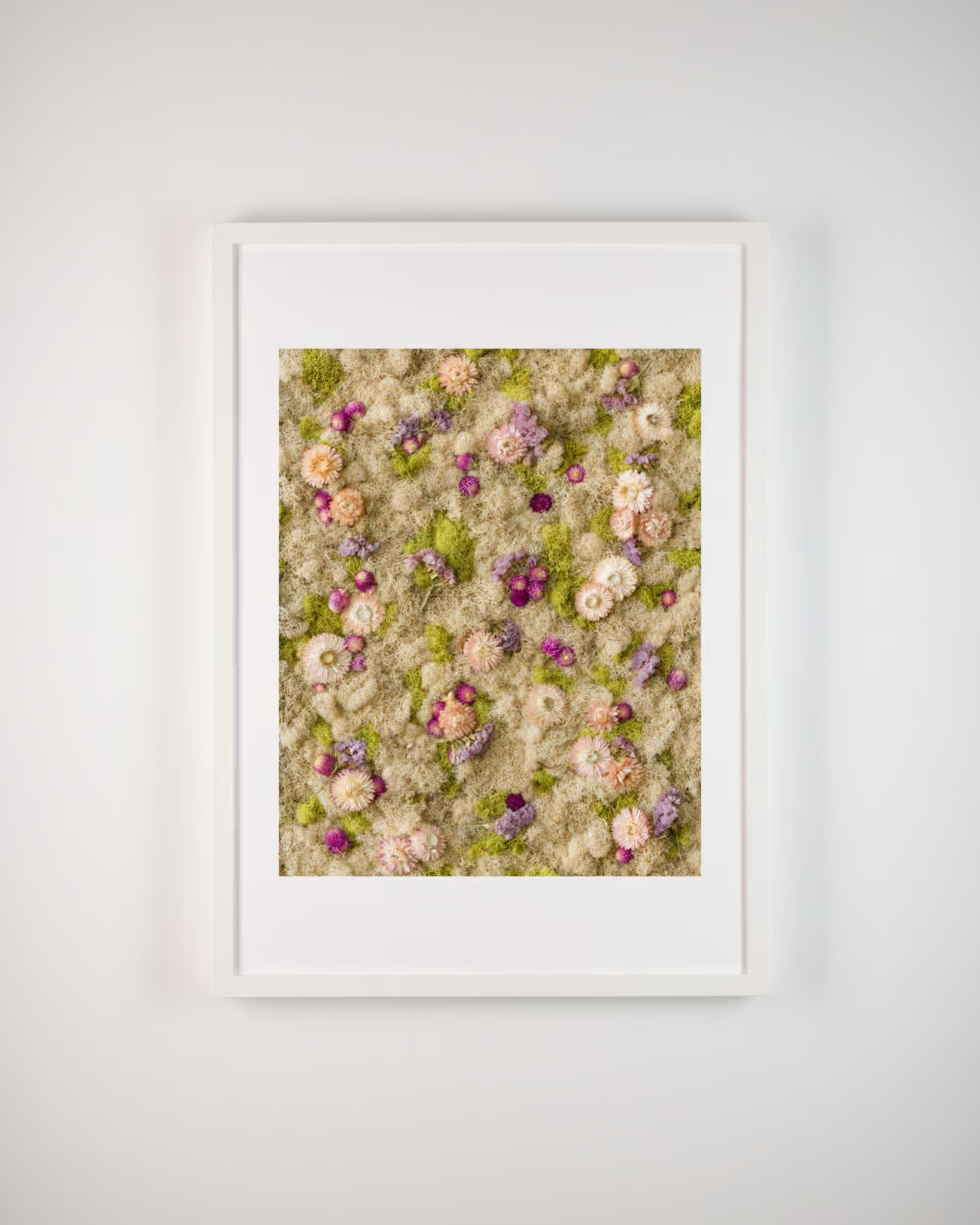 Nude, blush, and purple flowers on light green and nude moss wall in frame fine art print