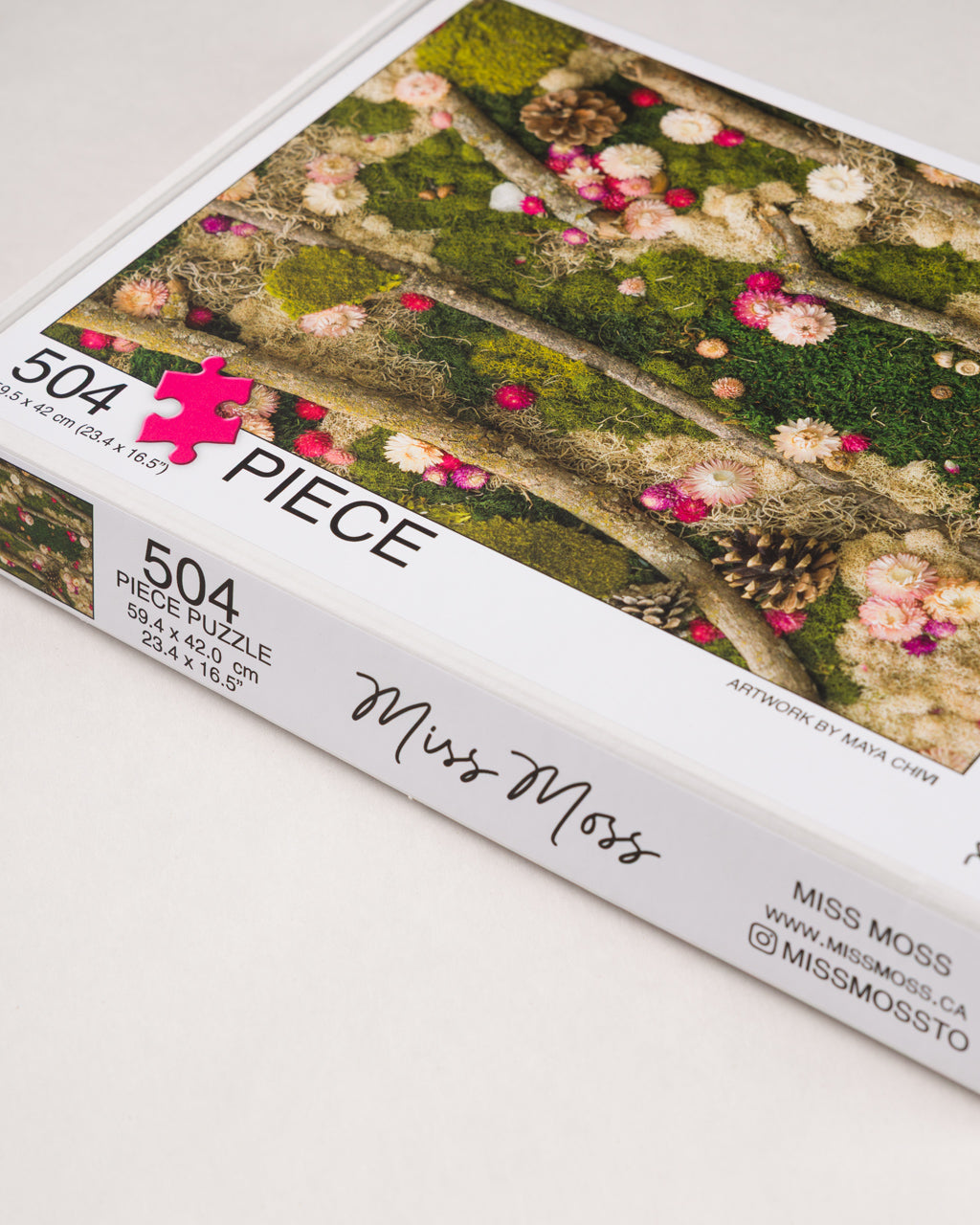 504 piece jigsaw puzzle of green moss wall with flowers and wood in nature 