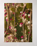 Completed 504 piece jigsaw puzzle of green moss wall with flowers and wood in nature