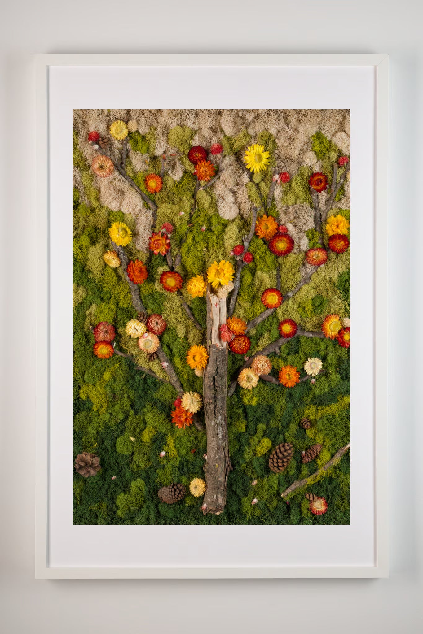 Green moss wall with branches and flowers in fall colours yellow and burnt orange fine art print shown in white frame