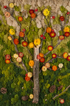 Green moss wall with branches and flowers in fall colours yellow and burnt orange fine art print